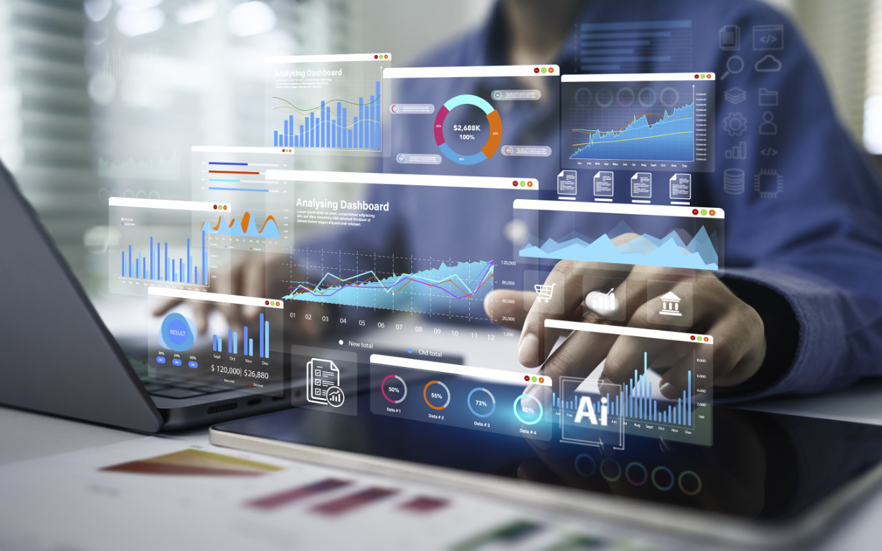 Business professionals analyzing data insights on multiple screens showing expert analysis workflows